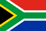 green sideways Y outlined in yellow and white surrounded by black, red and blue